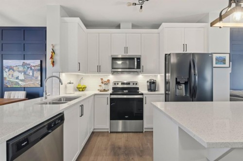 144 Legacy Point Se, Calgary, AB - Indoor Photo Showing Kitchen With Stainless Steel Kitchen With Double Sink With Upgraded Kitchen