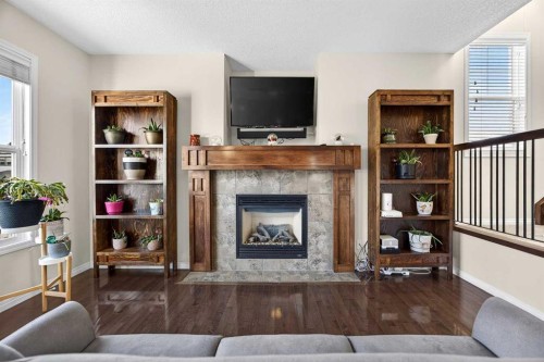 46 Heritage Landing, Cochrane, AB - Indoor Photo Showing Living Room With Fireplace