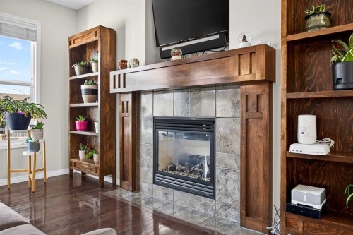 46 Heritage Landing, Cochrane, AB - Indoor Photo Showing Living Room With Fireplace