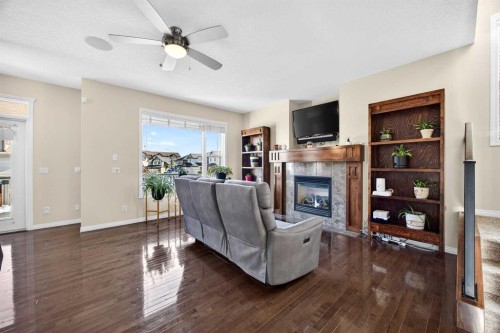 46 Heritage Landing, Cochrane, AB - Indoor Photo Showing Living Room With Fireplace