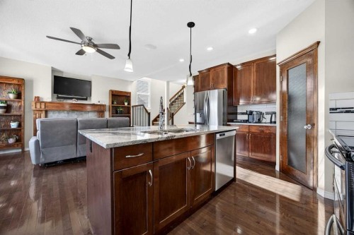46 Heritage Landing, Cochrane, AB - Indoor Photo Showing Kitchen With Stainless Steel Kitchen With Upgraded Kitchen