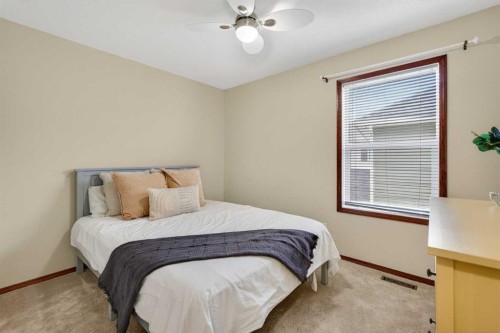 133 Cimarron Drive, Okotoks, AB - Indoor Photo Showing Bedroom