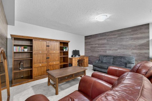 133 Cimarron Drive, Okotoks, AB - Indoor Photo Showing Living Room With Fireplace