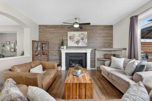 133 Cimarron Drive, Okotoks, AB - Indoor Photo Showing Living Room With Fireplace