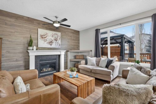 133 Cimarron Drive, Okotoks, AB - Indoor Photo Showing Living Room With Fireplace