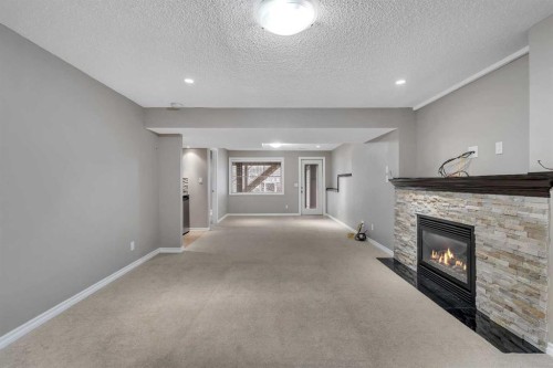 161 Silverado Range Cove Sw, Calgary, AB - Indoor With Fireplace