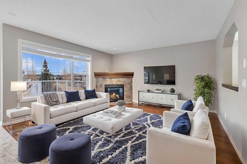 161 Silverado Range Cove Sw, Calgary, AB - Indoor Photo Showing Living Room With Fireplace