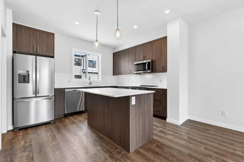 120-1750 Rangeview Drive Se, Calgary, AB - Indoor Photo Showing Kitchen With Stainless Steel Kitchen With Upgraded Kitchen