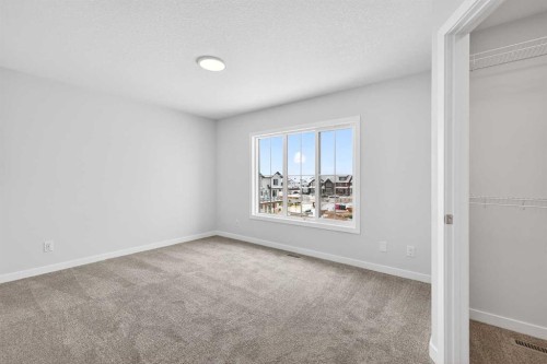 120-1750 Rangeview Drive Se, Calgary, AB - Indoor Photo Showing Other Room