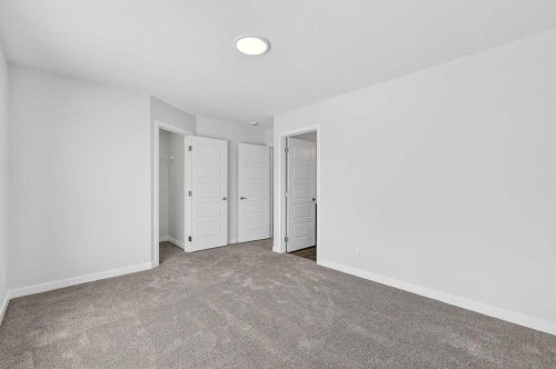 120-1750 Rangeview Drive Se, Calgary, AB - Indoor Photo Showing Other Room