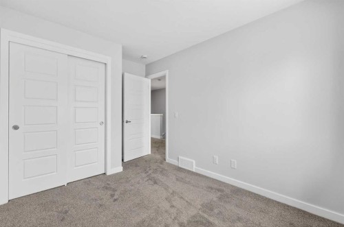 120-1750 Rangeview Drive Se, Calgary, AB - Indoor Photo Showing Other Room