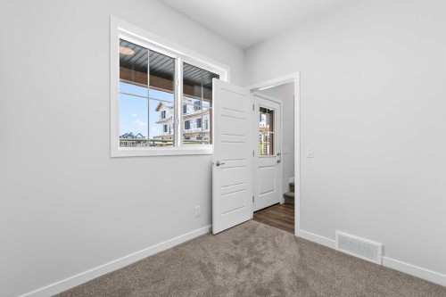 120-1750 Rangeview Drive Se, Calgary, AB - Indoor Photo Showing Other Room