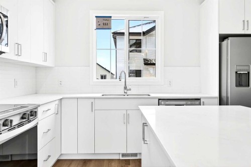 122-1750 Rangeview Drive Se, Calgary, AB - Indoor Photo Showing Kitchen