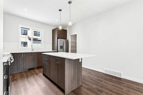 117-1750 Rangeview Drive Se, Calgary, AB - Indoor Photo Showing Kitchen With Upgraded Kitchen