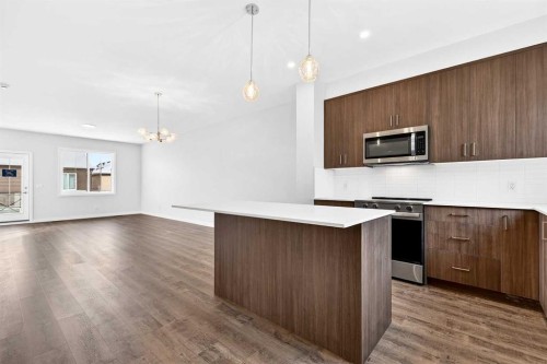 117-1750 Rangeview Drive Se, Calgary, AB - Indoor Photo Showing Kitchen With Upgraded Kitchen