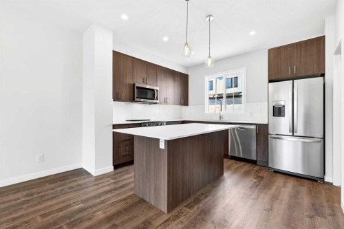 117-1750 Rangeview Drive Se, Calgary, AB - Indoor Photo Showing Kitchen With Stainless Steel Kitchen With Upgraded Kitchen