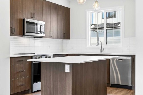 117-1750 Rangeview Drive Se, Calgary, AB - Indoor Photo Showing Kitchen With Upgraded Kitchen