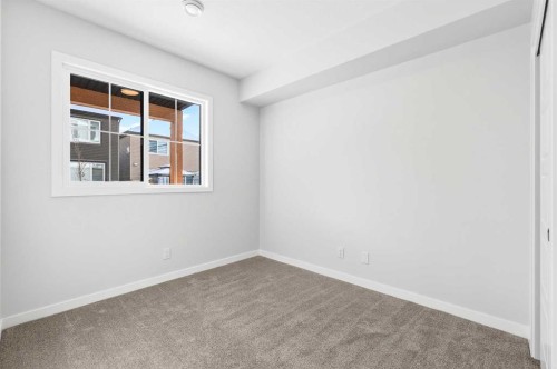 117-1750 Rangeview Drive Se, Calgary, AB - Indoor Photo Showing Other Room