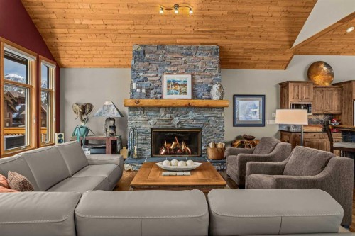116-210 Hubman Landing, Canmore, AB - Indoor Photo Showing Living Room With Fireplace
