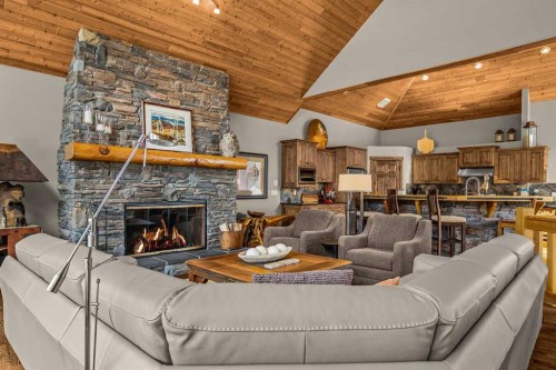 116-210 Hubman Landing, Canmore, AB - Indoor Photo Showing Living Room With Fireplace