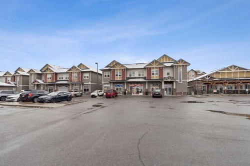 9312-101 Sunset Drive, Cochrane, AB - Outdoor With Facade
