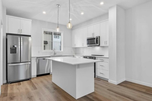125-1750 Rangeview Drive Se, Calgary, AB - Indoor Photo Showing Kitchen With Stainless Steel Kitchen With Upgraded Kitchen