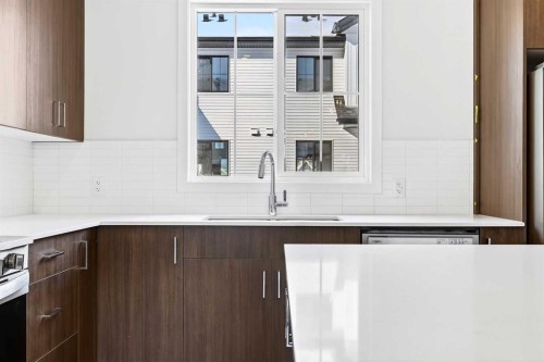 133-1750 Rangeview Drive Se, Calgary, AB - Indoor Photo Showing Kitchen With Double Sink With Upgraded Kitchen