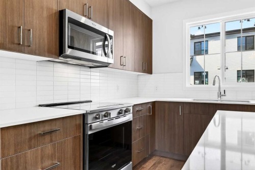 133-1750 Rangeview Drive Se, Calgary, AB - Indoor Photo Showing Kitchen With Upgraded Kitchen