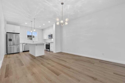 127-1750 Rangeview Drive Se, Calgary, AB - Indoor Photo Showing Kitchen With Stainless Steel Kitchen With Upgraded Kitchen