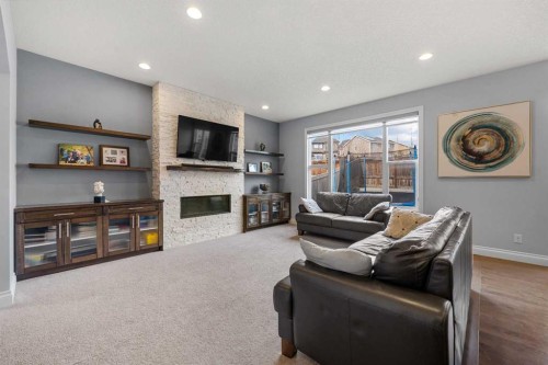 15 Sherwood Square Nw, Calgary, AB - Indoor Photo Showing Living Room With Fireplace