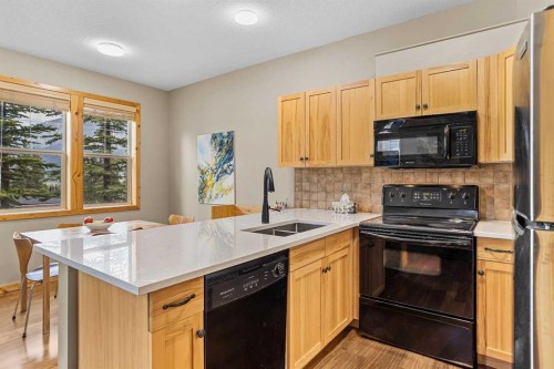201-70 Dyrgas Gate, Canmore, AB - Indoor Photo Showing Kitchen With Double Sink