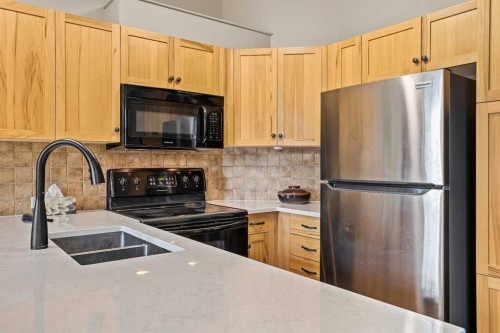 201-70 Dyrgas Gate, Canmore, AB - Indoor Photo Showing Kitchen With Double Sink