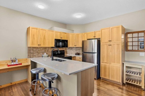 201-70 Dyrgas Gate, Canmore, AB - Indoor Photo Showing Kitchen With Double Sink