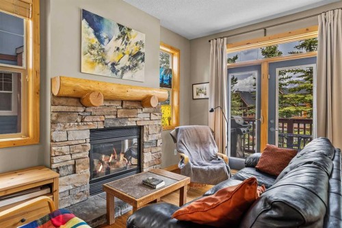 201-70 Dyrgas Gate, Canmore, AB - Indoor Photo Showing Living Room With Fireplace