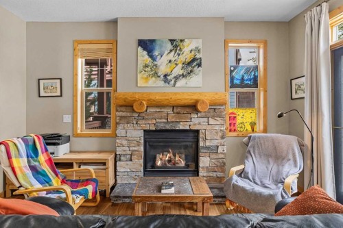 201-70 Dyrgas Gate, Canmore, AB - Indoor Photo Showing Living Room With Fireplace