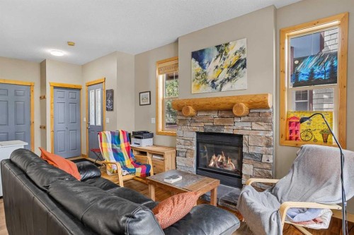 201-70 Dyrgas Gate, Canmore, AB - Indoor Photo Showing Living Room With Fireplace