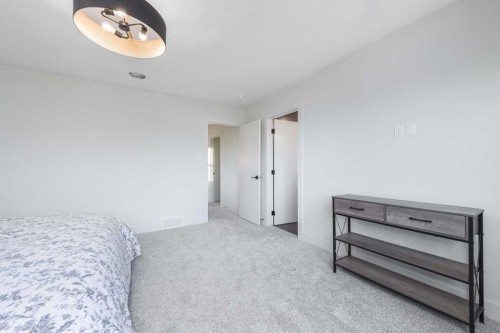 315 Waterford Road, Chestermere, AB - Indoor Photo Showing Bedroom