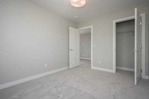141 Dawson Wharf View, Chestermere, AB - Indoor Photo Showing Other Room