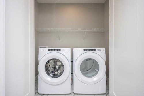 141 Dawson Wharf View, Chestermere, AB - Indoor Photo Showing Laundry Room