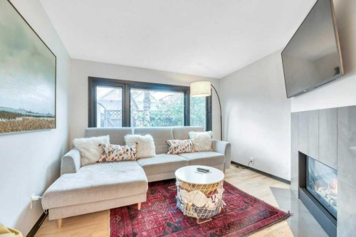 1940 Broadview Road Nw, Calgary, AB - Indoor Photo Showing Living Room With Fireplace