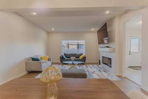 169 Verity Manor Sw, Calgary, AB - Indoor Photo Showing Living Room With Fireplace