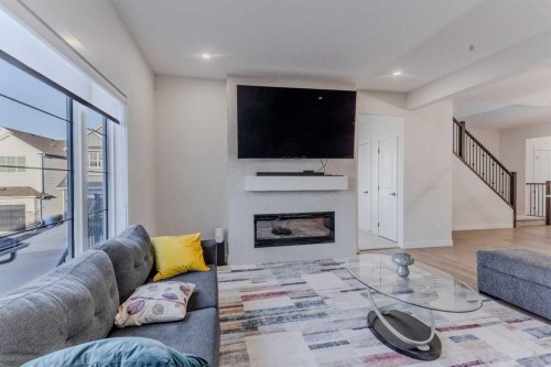 169 Verity Manor Sw, Calgary, AB - Indoor Photo Showing Living Room With Fireplace