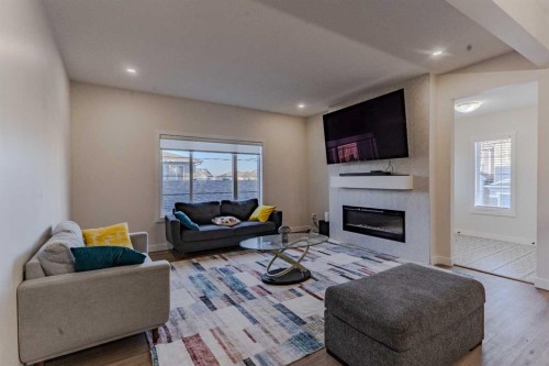 169 Verity Manor Sw, Calgary, AB - Indoor Photo Showing Living Room With Fireplace