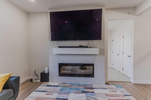 169 Verity Manor Sw, Calgary, AB - Indoor Photo Showing Other Room With Fireplace
