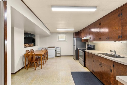 4613 48 Avenue, Olds, AB - Indoor Photo Showing Kitchen With Double Sink