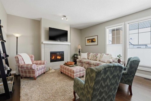 26 Cranbrook Villas Se, Calgary, AB - Indoor Photo Showing Living Room With Fireplace