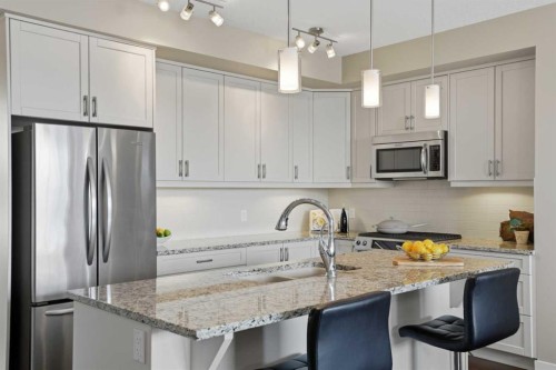 26 Cranbrook Villas Se, Calgary, AB - Indoor Photo Showing Kitchen With Stainless Steel Kitchen With Upgraded Kitchen