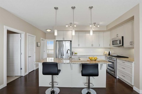 26 Cranbrook Villas Se, Calgary, AB - Indoor Photo Showing Kitchen With Stainless Steel Kitchen With Upgraded Kitchen