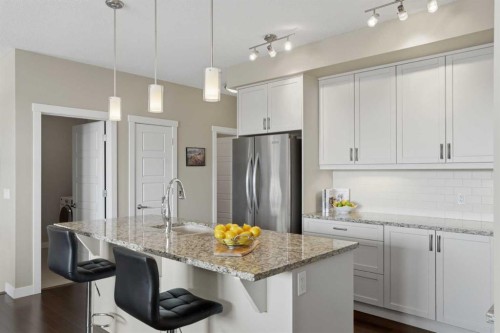 26 Cranbrook Villas Se, Calgary, AB - Indoor Photo Showing Kitchen With Stainless Steel Kitchen With Upgraded Kitchen