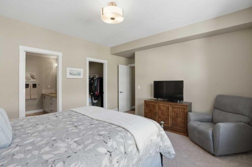 26 Cranbrook Villas Se, Calgary, AB - Indoor Photo Showing Bedroom